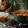 Refrigerated curry being reheated thoroughly in a saucepan