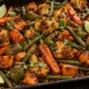 Tray of crispy podi-roasted cauliflower, carrots, beans, sweet potato and capsicum