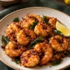 Cooked Karnataka podi prawns with curry leaves and lemon