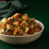 Bread upma with distinct bread cubes, onion, tomato and a light podi coating.