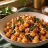 Warm chickpea sundal with podi, mustard seeds and curry leaves