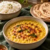 Yellow moong dal with a podi finish served with rice and roti
