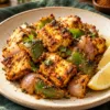 Podi paneer tikka with capsicum, onion and lemon on a plate